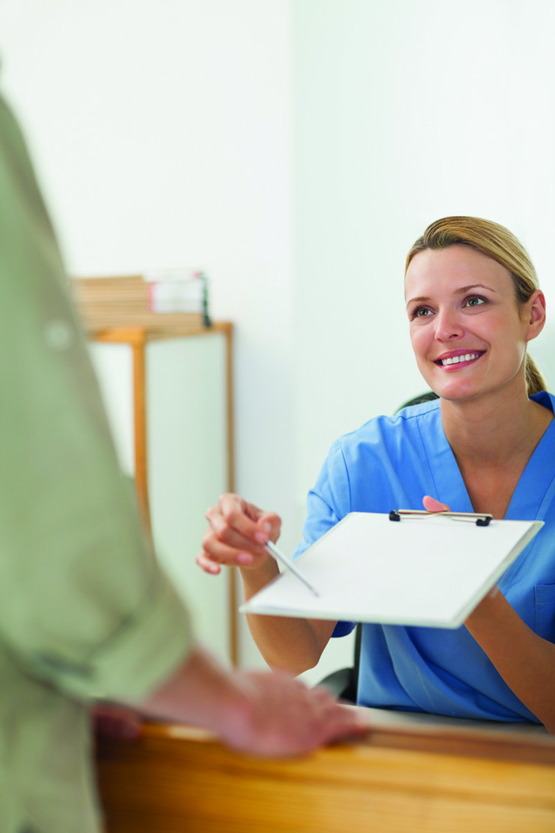 Nurse asking the signature of a patient