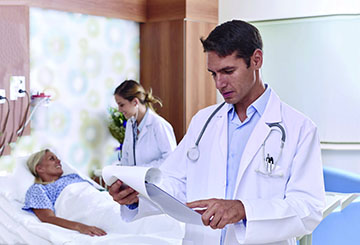 Doctor and nurse making rounds in hospital