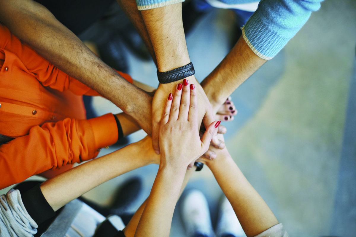 Stack of hands a teamwork symbol